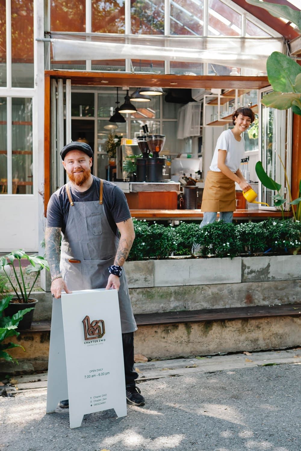 woman and man outside a coffee shop