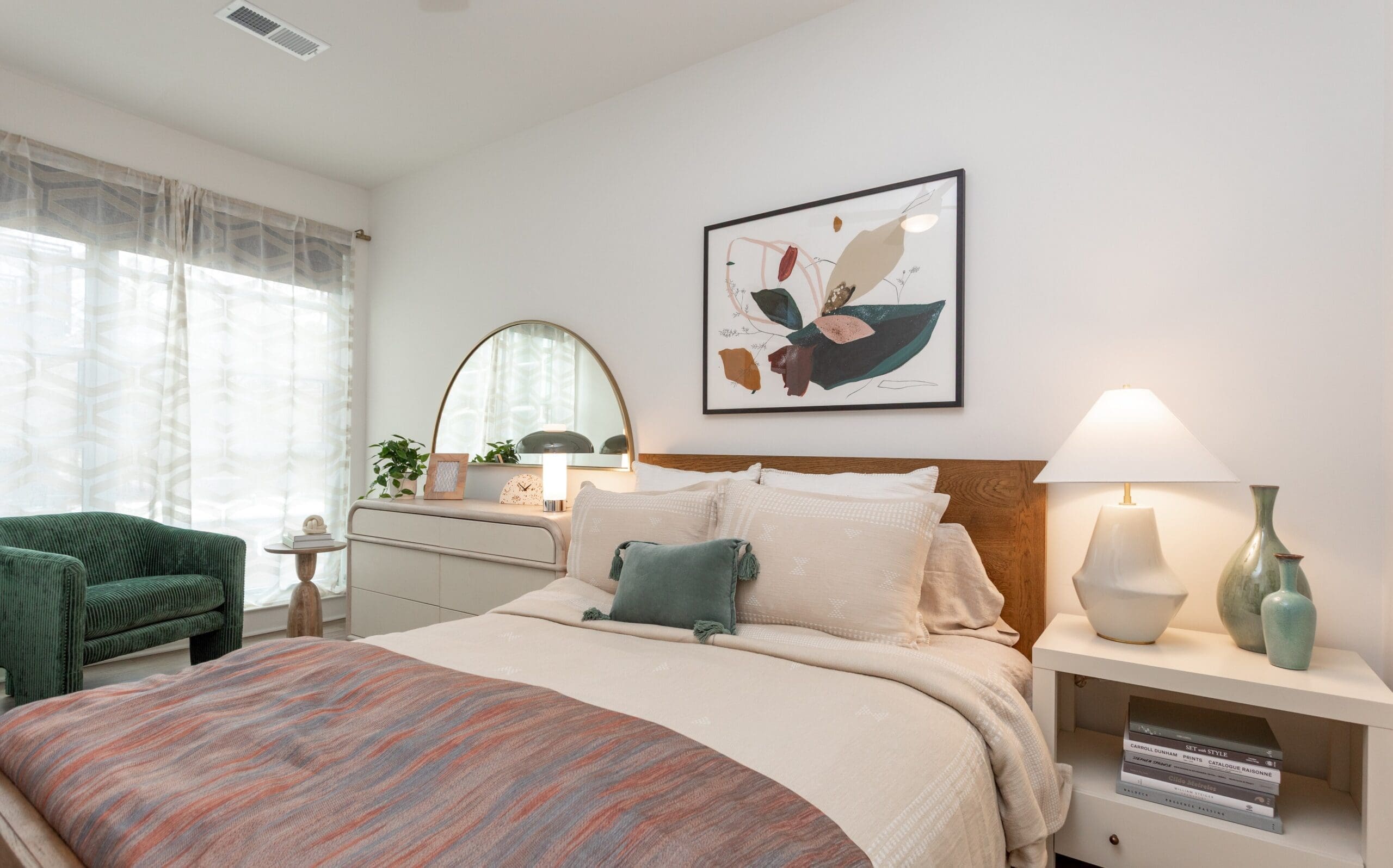 Contemporary furnished model bedroom at The Row apartments in Raleigh NC