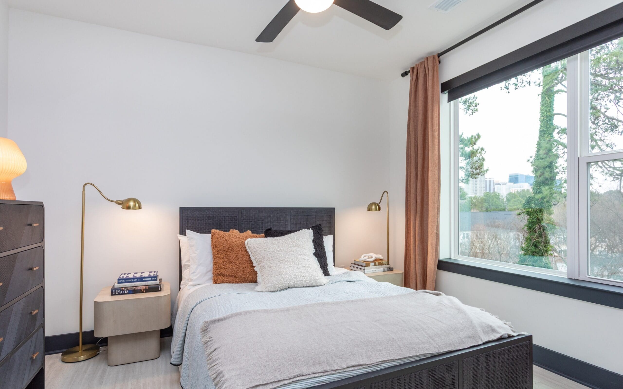 Modern Bedroom layout with large window at The Row apartments Raleigh NC