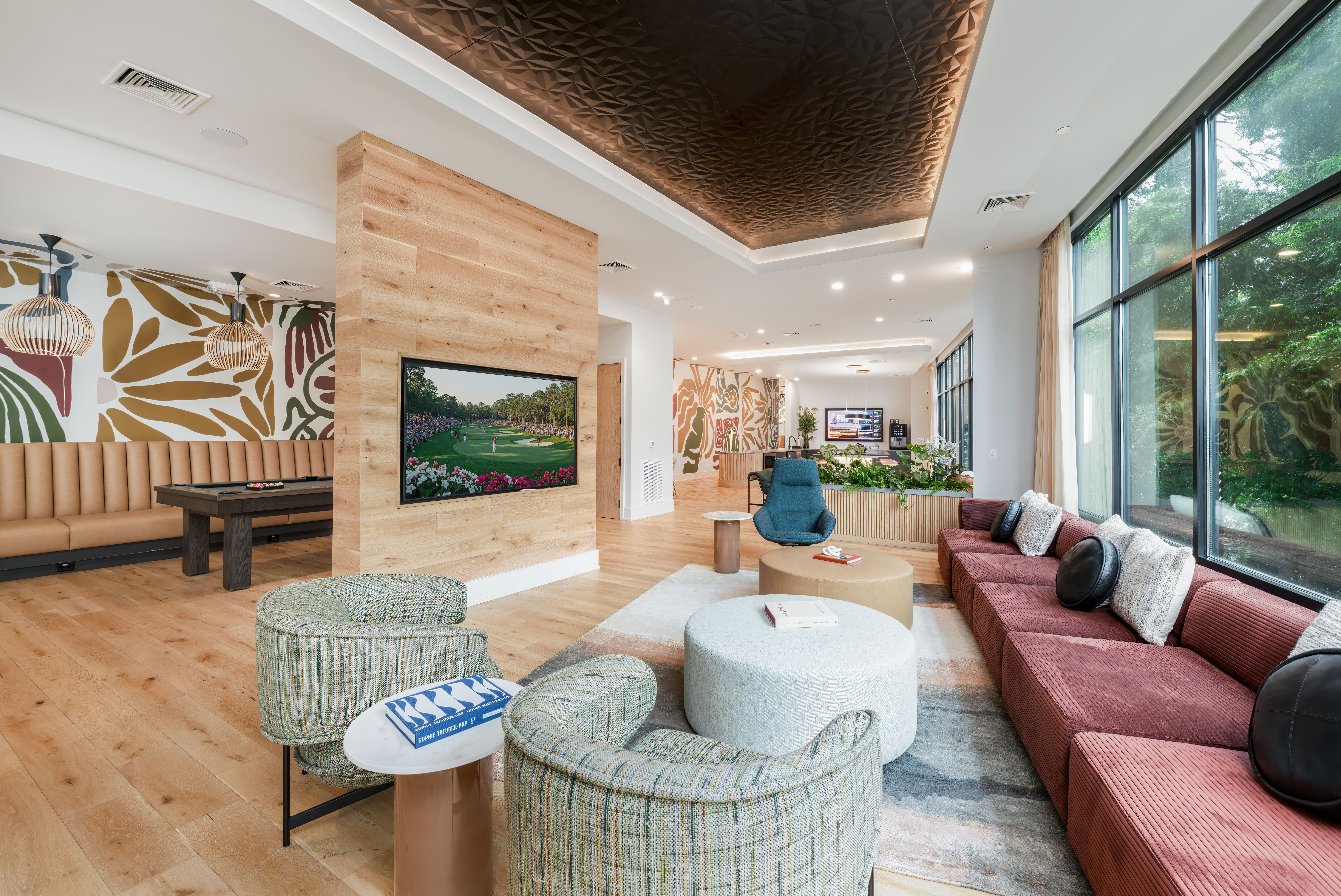 Stylish resident clubhouse lounge at The Row apartments Raleigh NC