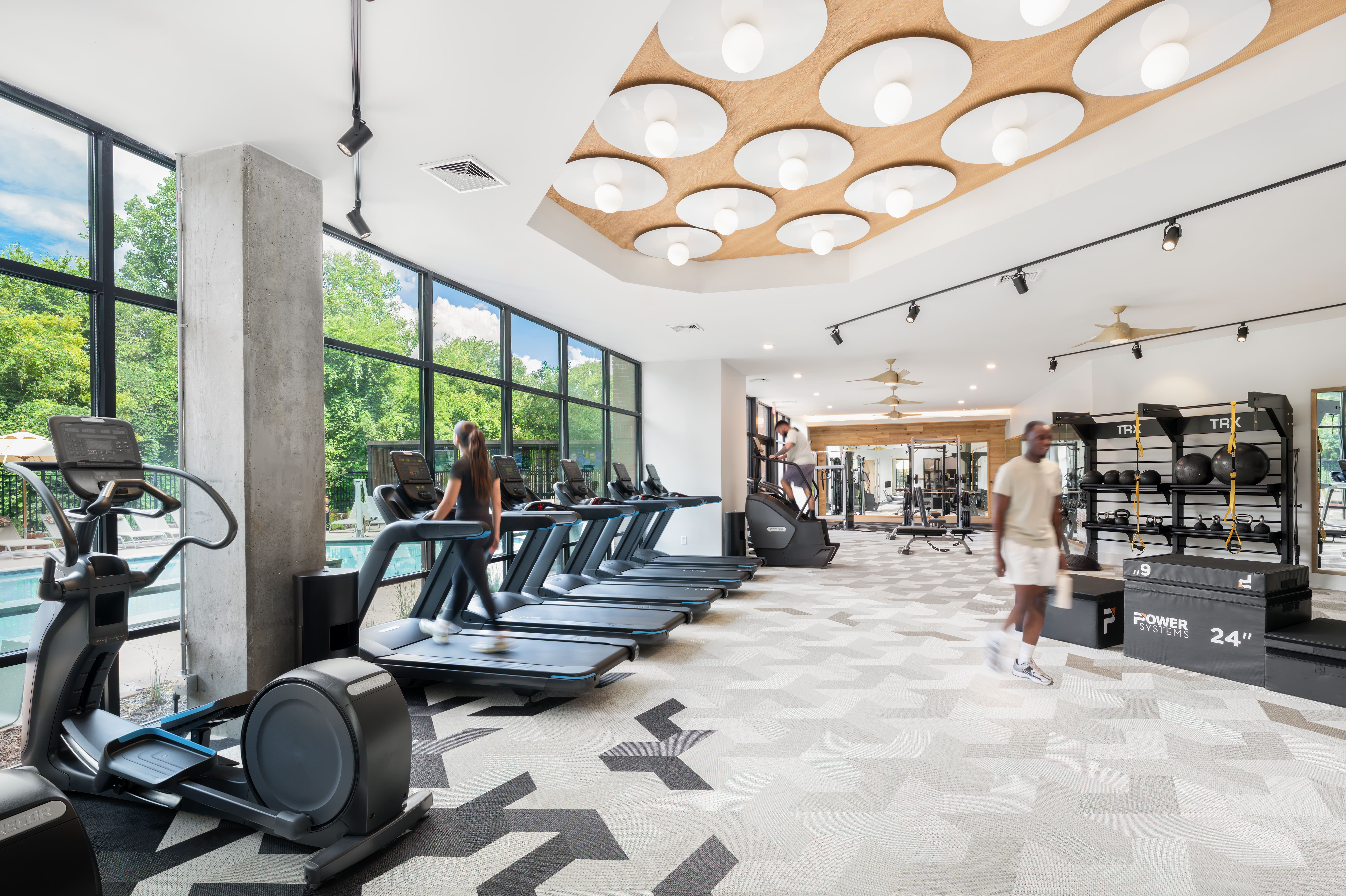 Modern fitness center with high-end equipment at The Row apartments in Raleigh NC