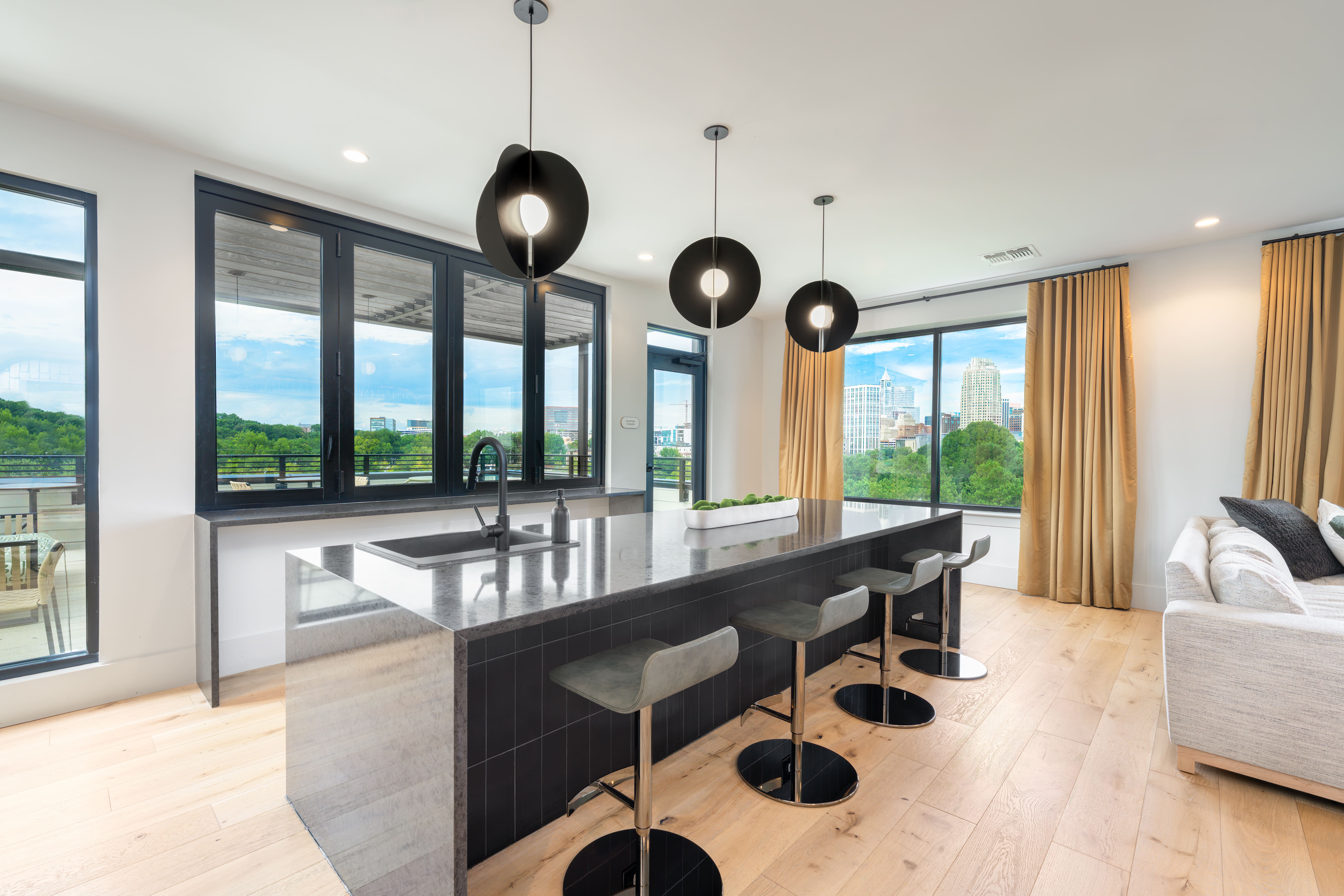 Rooftop amenity deck with skyline views at The Row apartments Raleigh NC